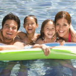 Family in swimming pool